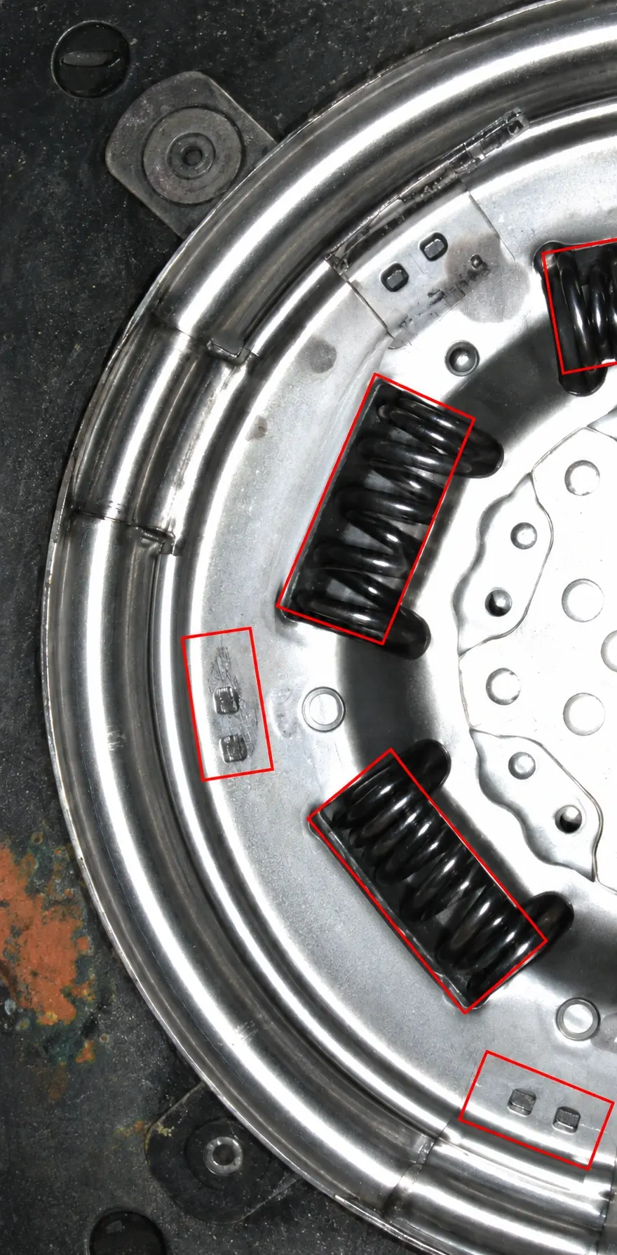 Springs and rivets inspected together on a circular automotive assembly